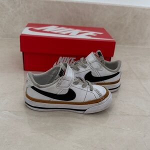 Nike Court Legacy White Sneakers with Black Swoosh and Brown Accent
